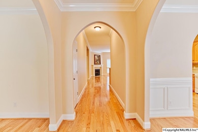 The arched doorways, smooth ceilings and warm finishes greet you just inside the front door.
