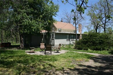 Te backyard has a patio and fire pit.