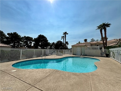 Community pool with a patio area