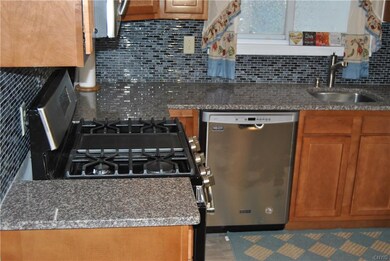 Lovely granite counter tops with a five burner ove