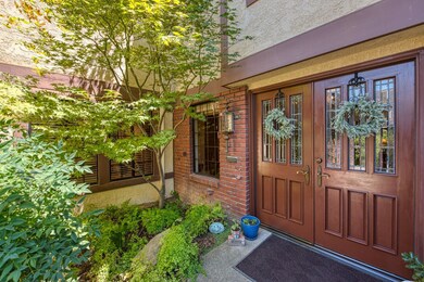 Elegant double-door entry with glass panels