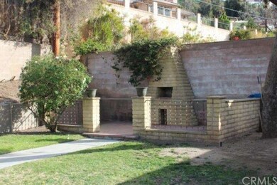 lots of charm in this back yard with a brick bbq