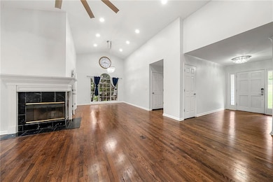 Living Area with Chandelier and Fresh Neutral Paint for a Modern, Clean Look