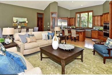 The open floor plan of the kitchen, family room, a