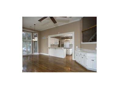 Breakfast room, kitchen, and hearth room with wet 