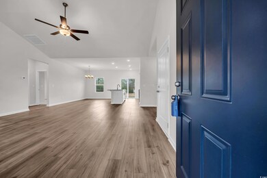 Foyer featuring visible vents, baseboards, lofted 