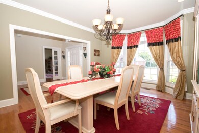 Spacious dining room with bay window and built in buffet