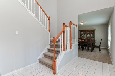 Formal dining is to the right of the entry