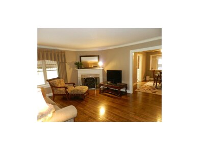 LIVING ROOM OPENS TO DINING