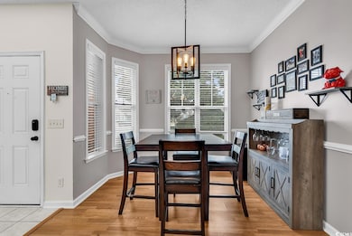 Dining room featuring a textured ceiling, a notabl