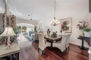 Dining room with visible vents, dark wood-style fl