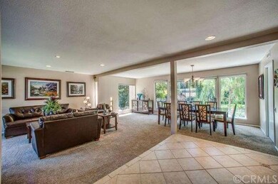 Entry area with living room and dining area.