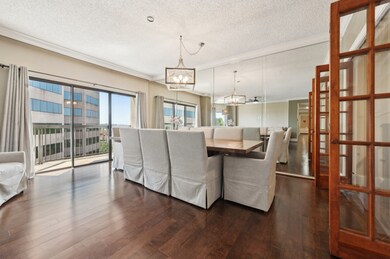 Dining area with sliding doors to balcony with views of Tangle Wood Park