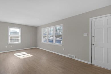 Unfurnished room with hardwood / wood-style floors
