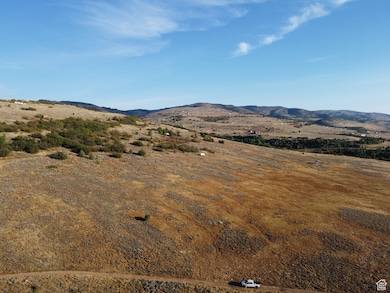 View of mountain backdrop with rural landscape