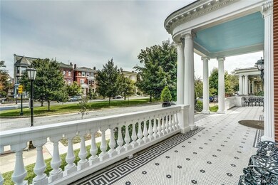 The tiled terrace with decorative greek key border is a handsome finishing detail to this stunning entry.