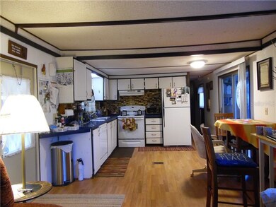 Kitchen with eating space, sliders out to the Flor