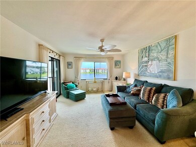 Living room with light colored carpet, a water vie
