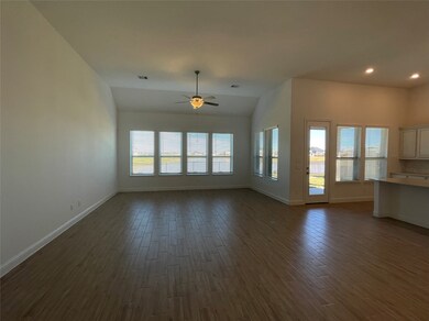 Family room with wall of windows to display the relaxing Lakeview!