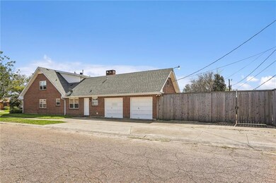 Side view showing two car garage and rear yard acc