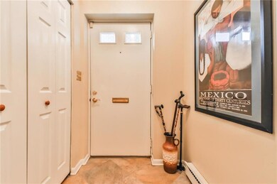 Accented Tiled Entry with Guest Closet