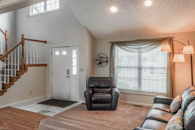 The front living room has cathedral ceilings and r