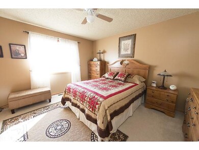 Master bedroom features sitting area and large clo