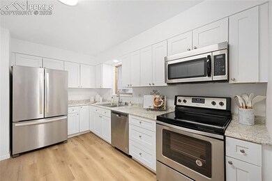 Kitchen featuring appliances with stainless steel 
