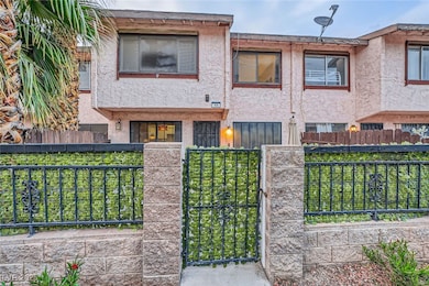 View of front of home featuring stucco siding, a g