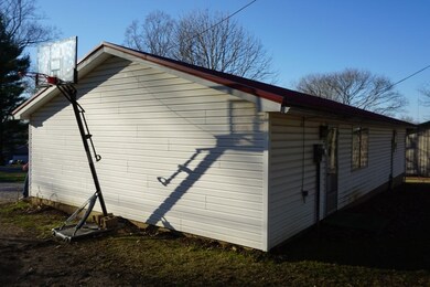 Side view of the home shows the yard space availab