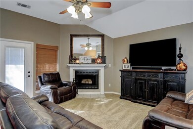Family room with vaulted ceiling and fireplace