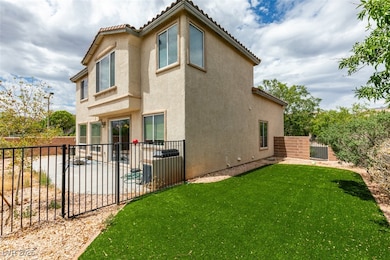 Back of house with fence, a tiled roof, a patio, a