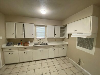 Kitchen **Home interior and exterior under construction. New floors, paint, fixtures and appliances to come.**