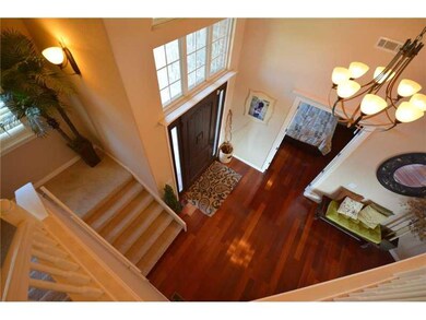 Interior Space/Layout. View from Upstairs into Entry/Foyer