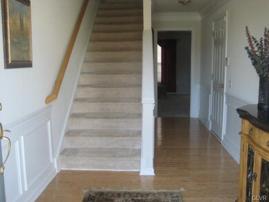 An oversized foyer greets you as you enter this pr