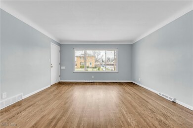Spare room with light hardwood / wood-style floors