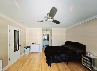 Master Bedroom with ceiling fan, light hardwood / 
