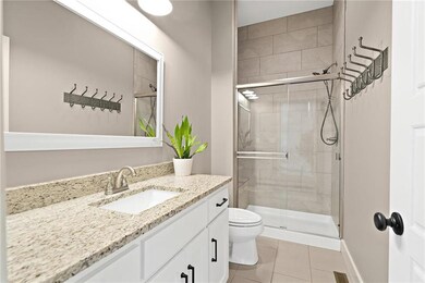Full bath on main level has granite and upgraded t