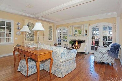 Great room living area with beamed ceilings, firep
