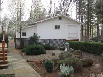 Detached 2 story shop and a portion of the side ya