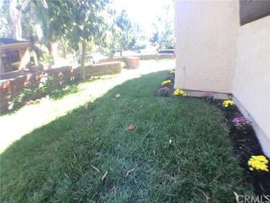 Freshly landscaped with new grass and flowers thro