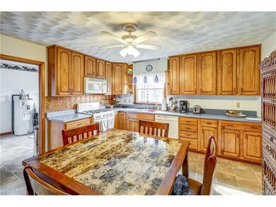 Kitchen is spacious with eat-in area and is open t