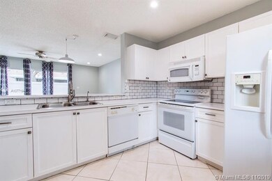 Open concept kitchen to living room and back patio