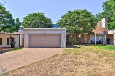 View of front facade featuring a garage and a fron