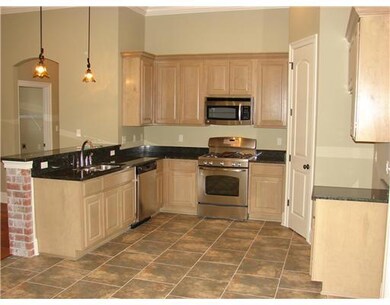 Kitchen. Kitchen boasts of solid wood custom cabin