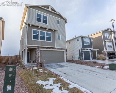 View of property featuring a garage