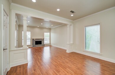 Spacious bedroom with a cozy fireplace and room fo