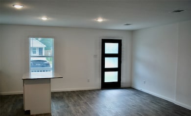 Living room provides laminate flooring and open concept to the breakfast and kitchen.