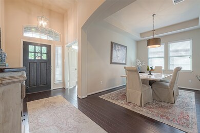 Upon entering the home, one is greeted by an inviting view that seamlessly blends comfort and style, with spacious interiors bathed in natural light. The warm ambiance, coupled with tasteful decor and thoughtful design elements, creates an immediate sense of welcome and relaxation for all who step inside.