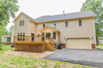 Paved driveway from front to rear of home